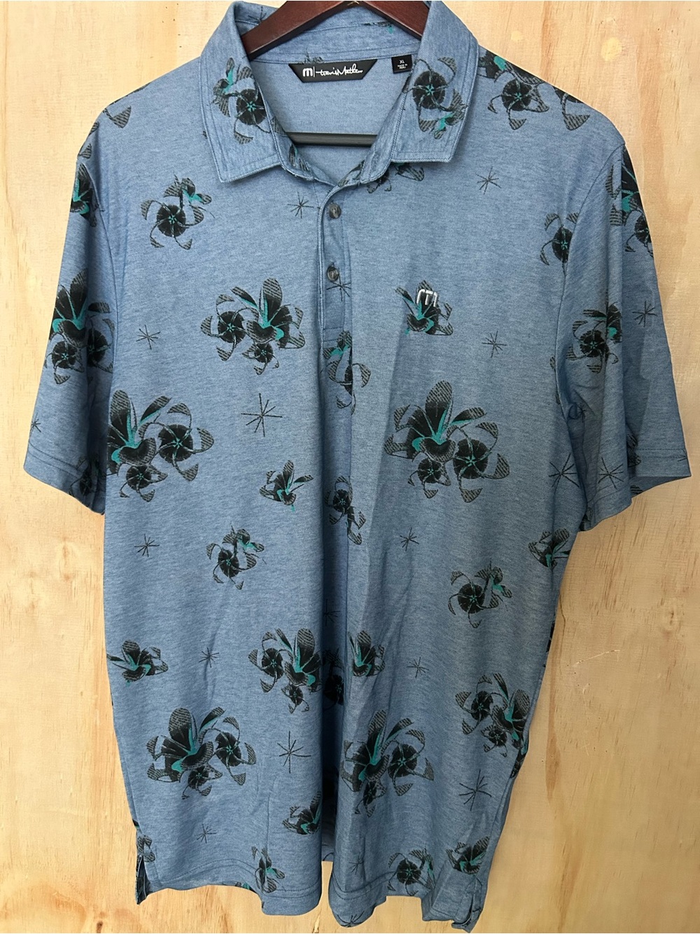 Travis Mathew Heather Blue Polo with Teal and Black Floral Print